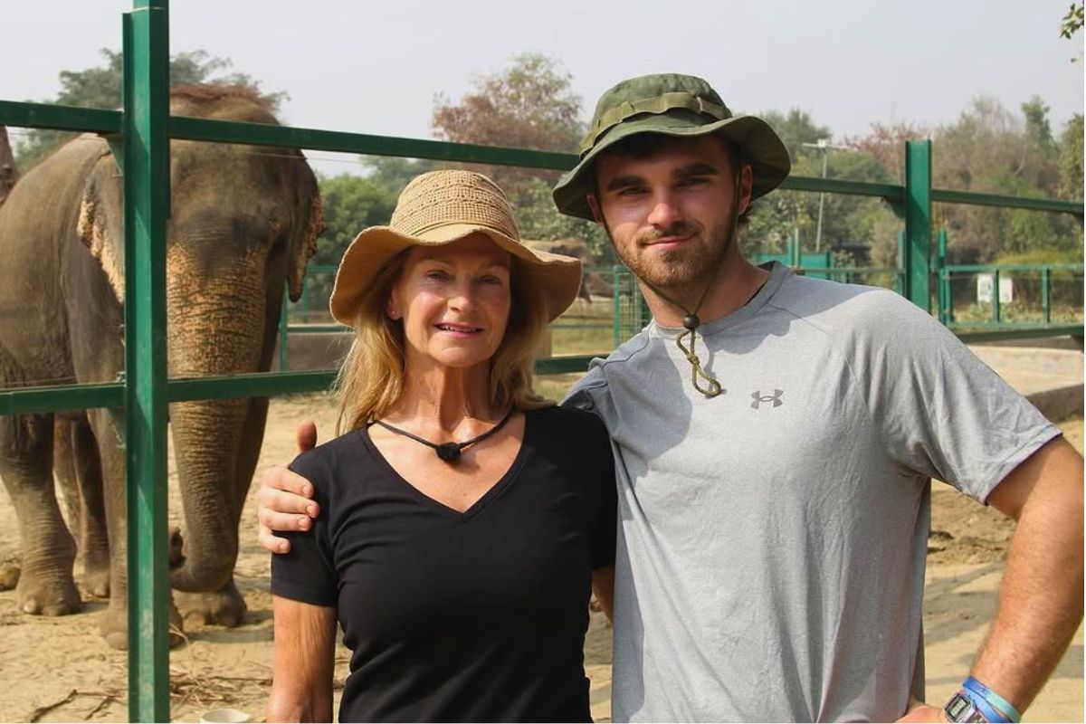 caroline bridge with son thomas bridge posing for a photograph in front of an elephant