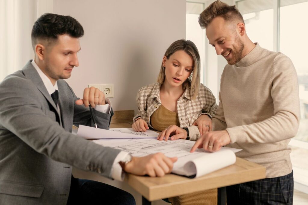 three people discussing setting up a limited company for property