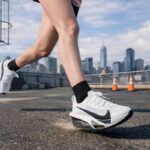 a women running wearing a carbon plated running shoes, helpful for both men and women