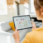 a girl operating smart home devices from her tablet