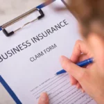uk business insurance claim form held by a person