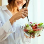 a girl eating healthiest food bowl