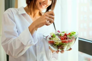 a girl eating healthiest food bowl