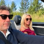 guy phoenix wife, michelle phoenix is sitting next to him while he was driving the car